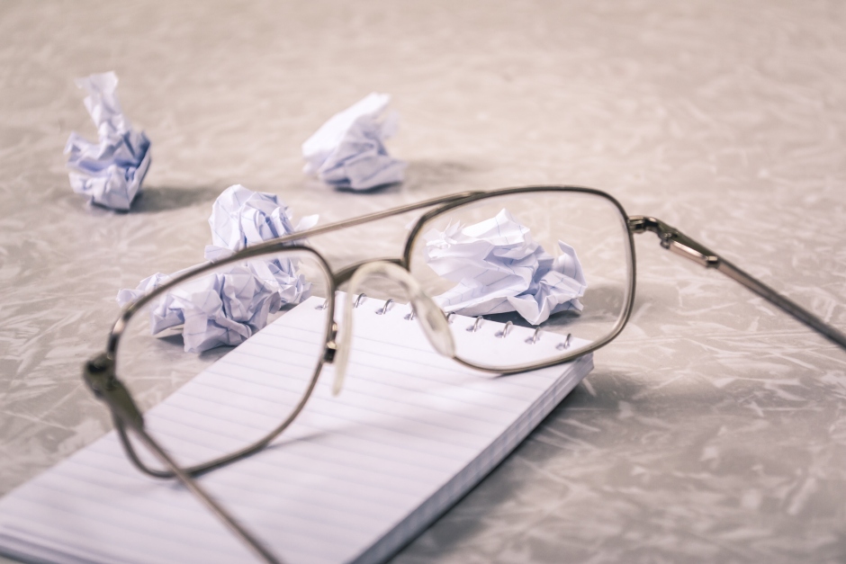 glasses-in-front-of-crumpled-paper