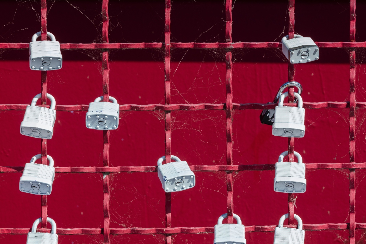 white-locks-on-red-fence