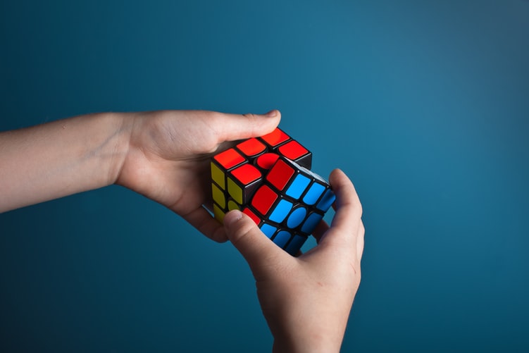 Person solving rubix cube