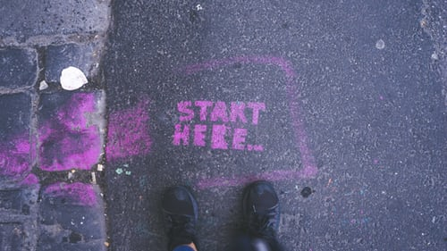 Start here written in chalk