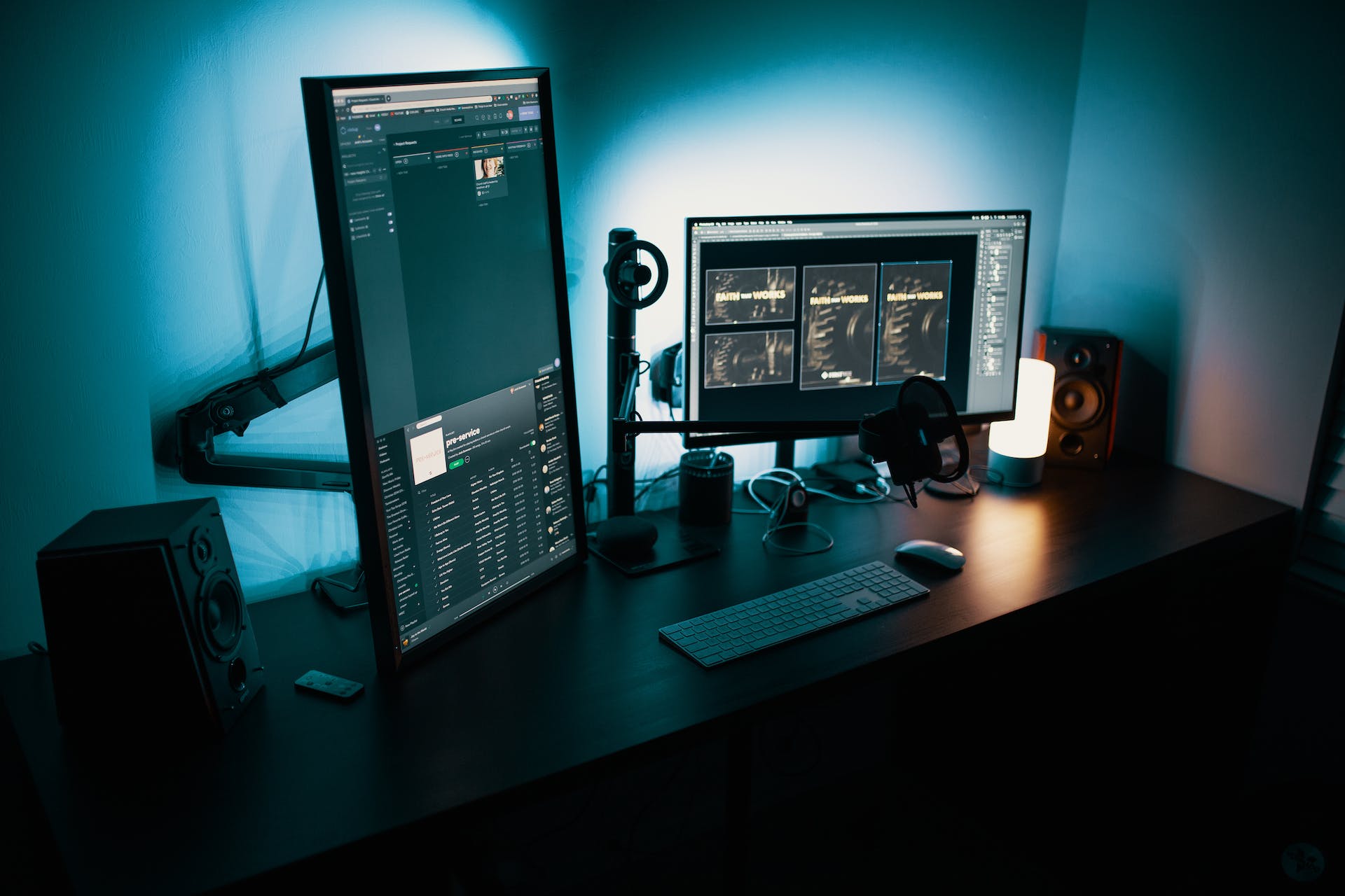 Dark room with multiple monitors on a desk